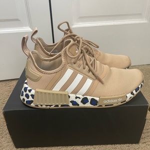 Woman’s Adidas Tan NMD sneakers